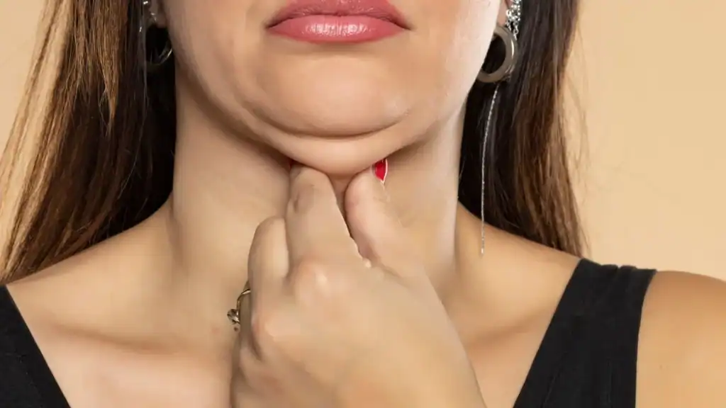An image of a woman with double chin, sad, worried : Non Surgical Double Chin Removal Treatment in Crawley, UK